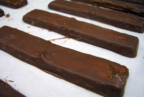 The shortbread cookie inside the Malt Bar has to be pre-coated with tempered milk chocolate before the ganache can go on top of it.